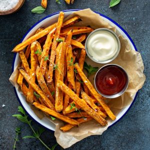 Sweet potato fries with mayo and ketchup, homemade roasted in the oven